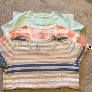 Three Gap tees, two are a crewneck, orange and white stripe is a V-neck.